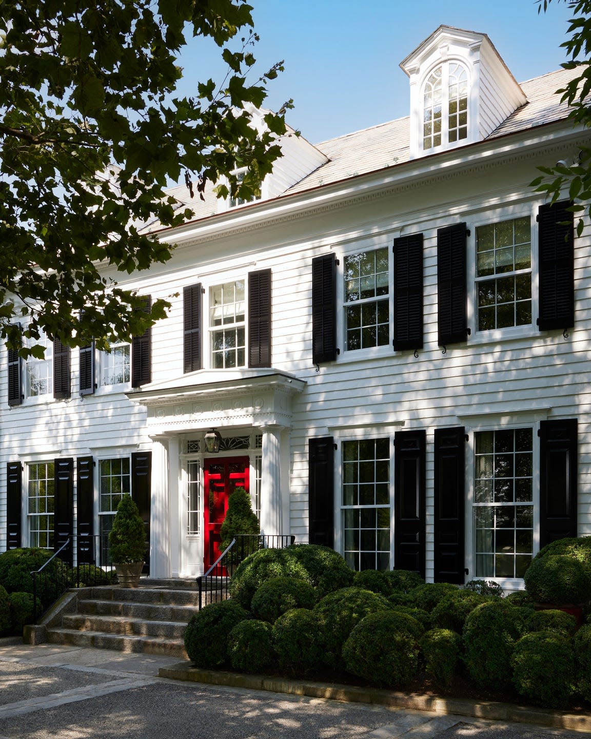 A white house with a red door