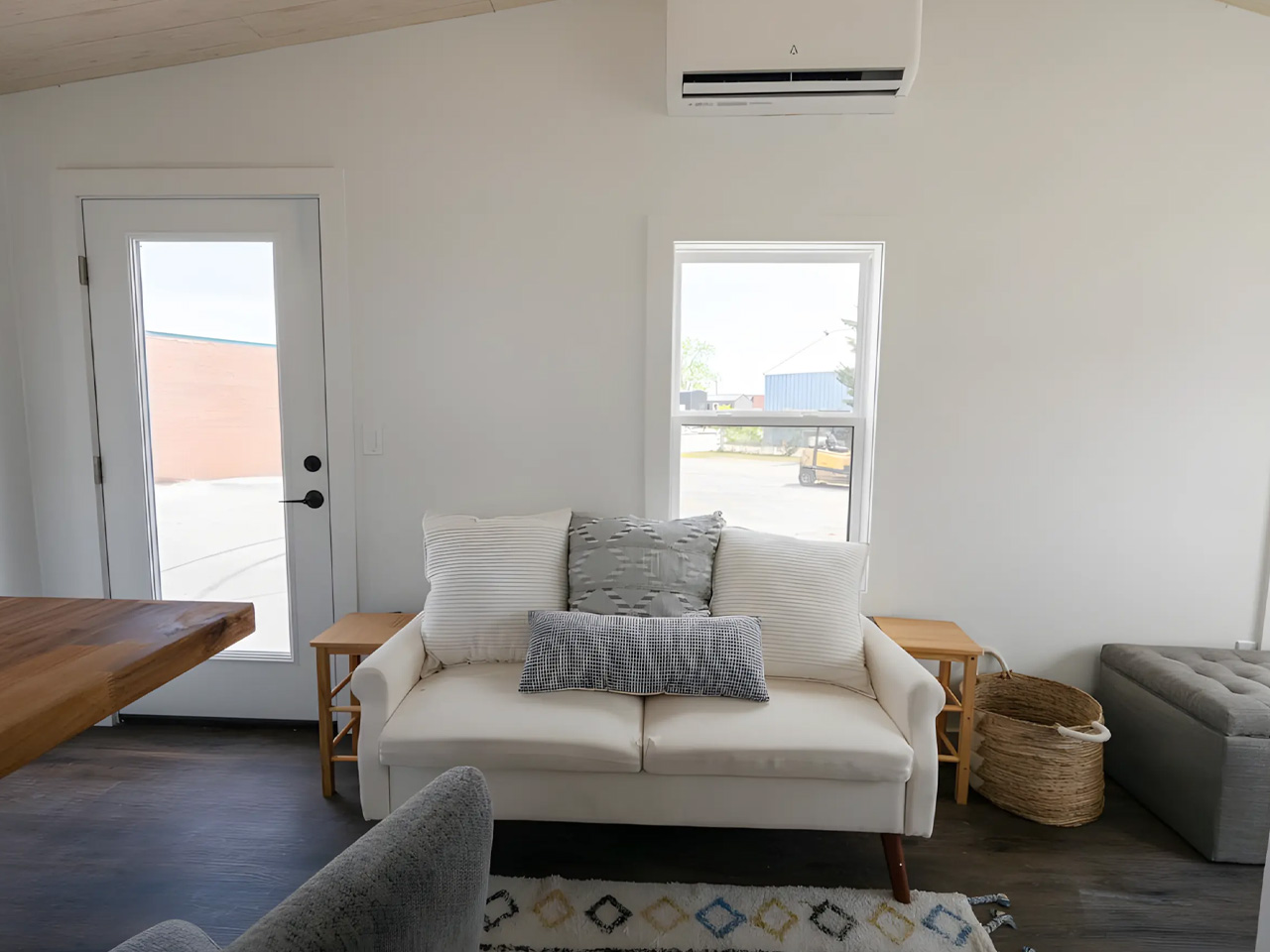 An affordable one -story tiny house offers a spacious interior, modern amenities and nationwide delivery