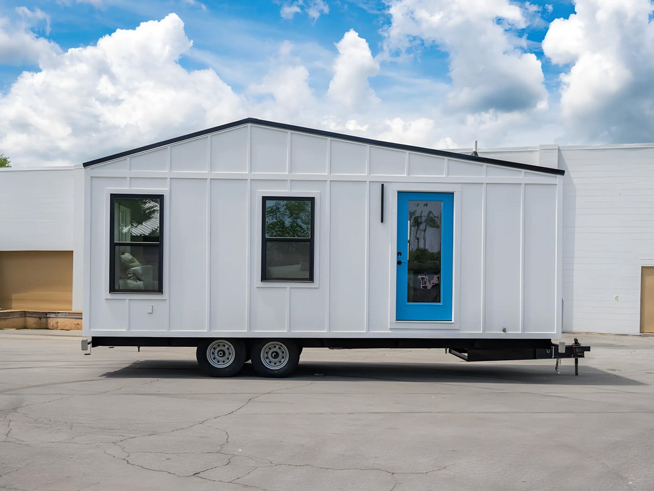 An affordable one -story tiny house offers a spacious interior, modern amenities and nationwide delivery