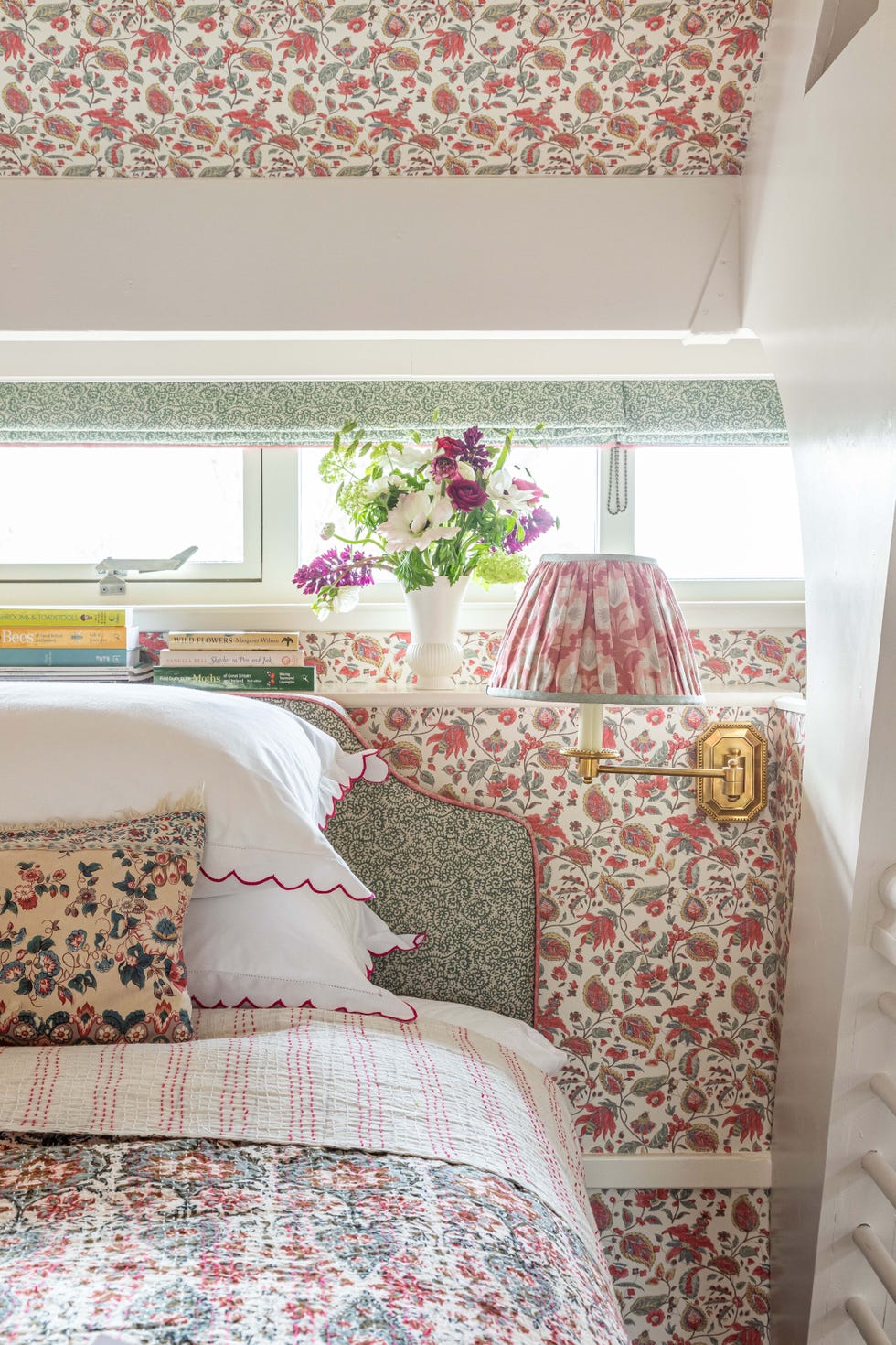 A bedroom with many flower patterns A bedroom with many flower patterns