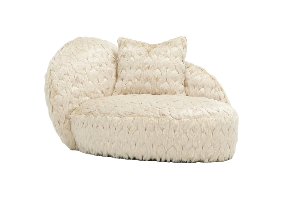 curved upholstered chair in cream color