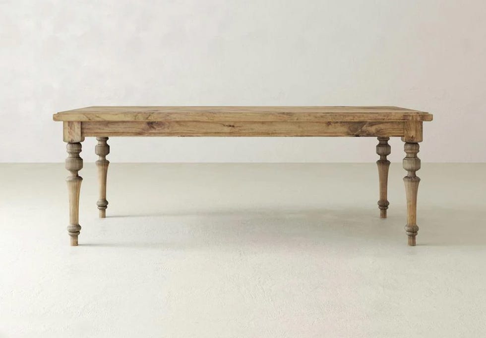 Wooden dining table with twisted legs