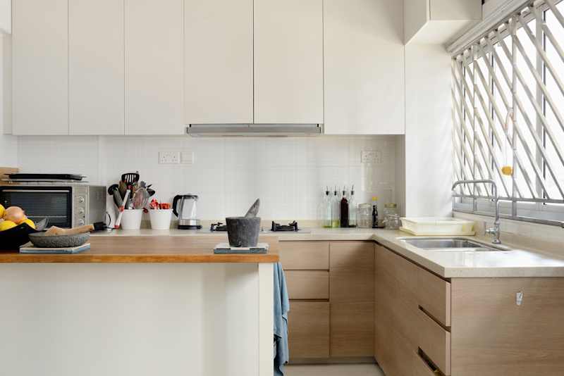 Home kitchen with white cupboards and an island