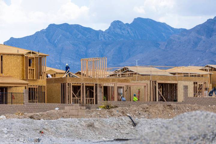 The workers complete framework and walls on the new building on the Skye Canyon on Wednesday, Jul ...
