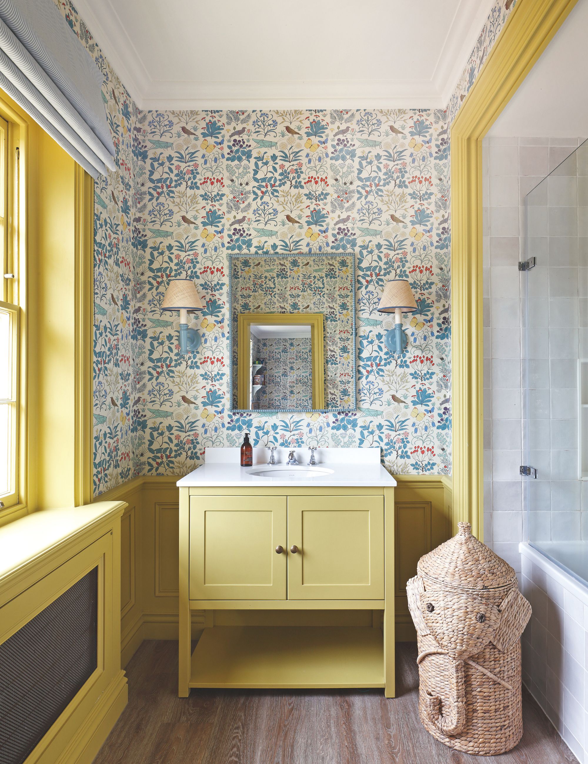 Children's bath with yellow wood and colorful wallpaper