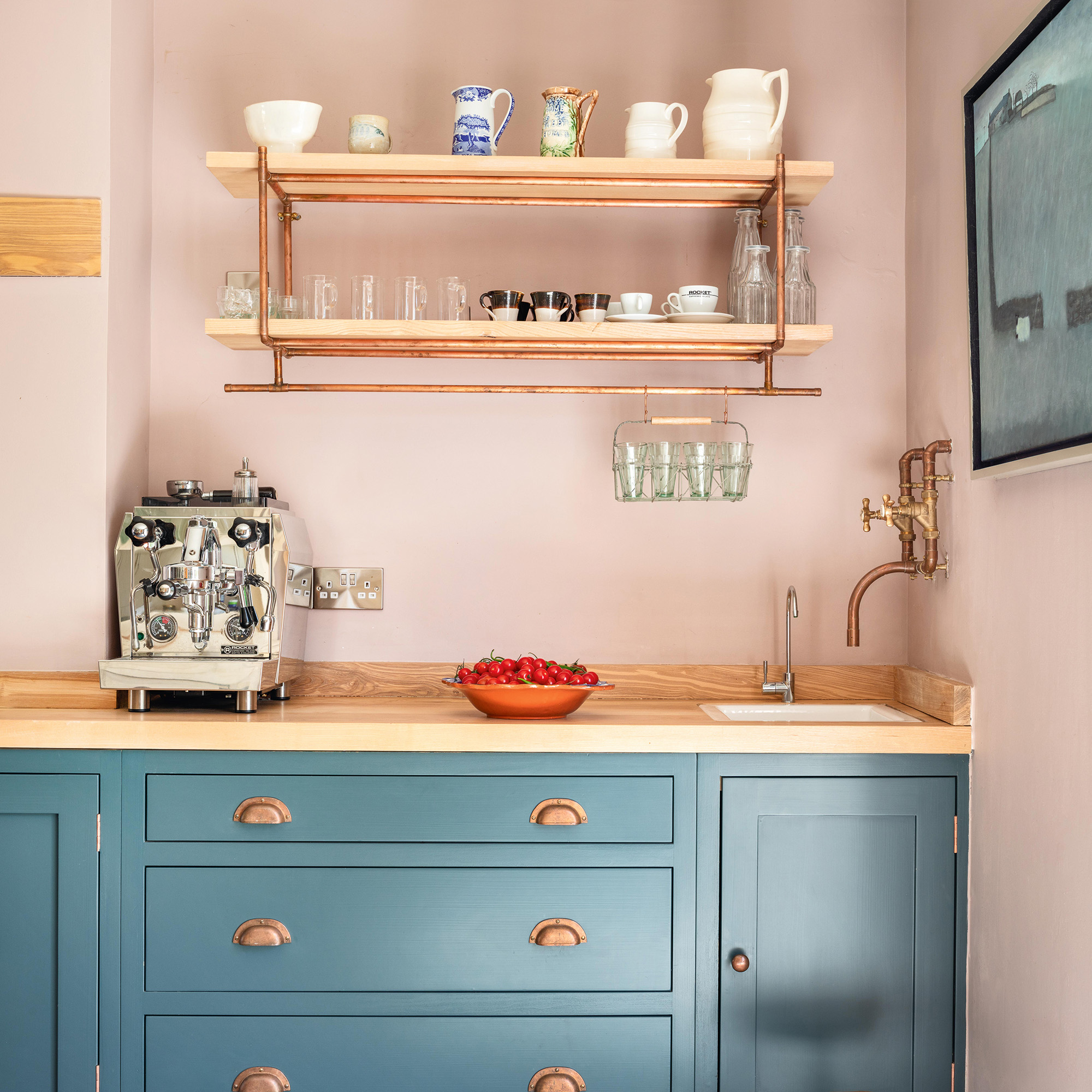 Coffee station in the land kitchen with pink walls and blue