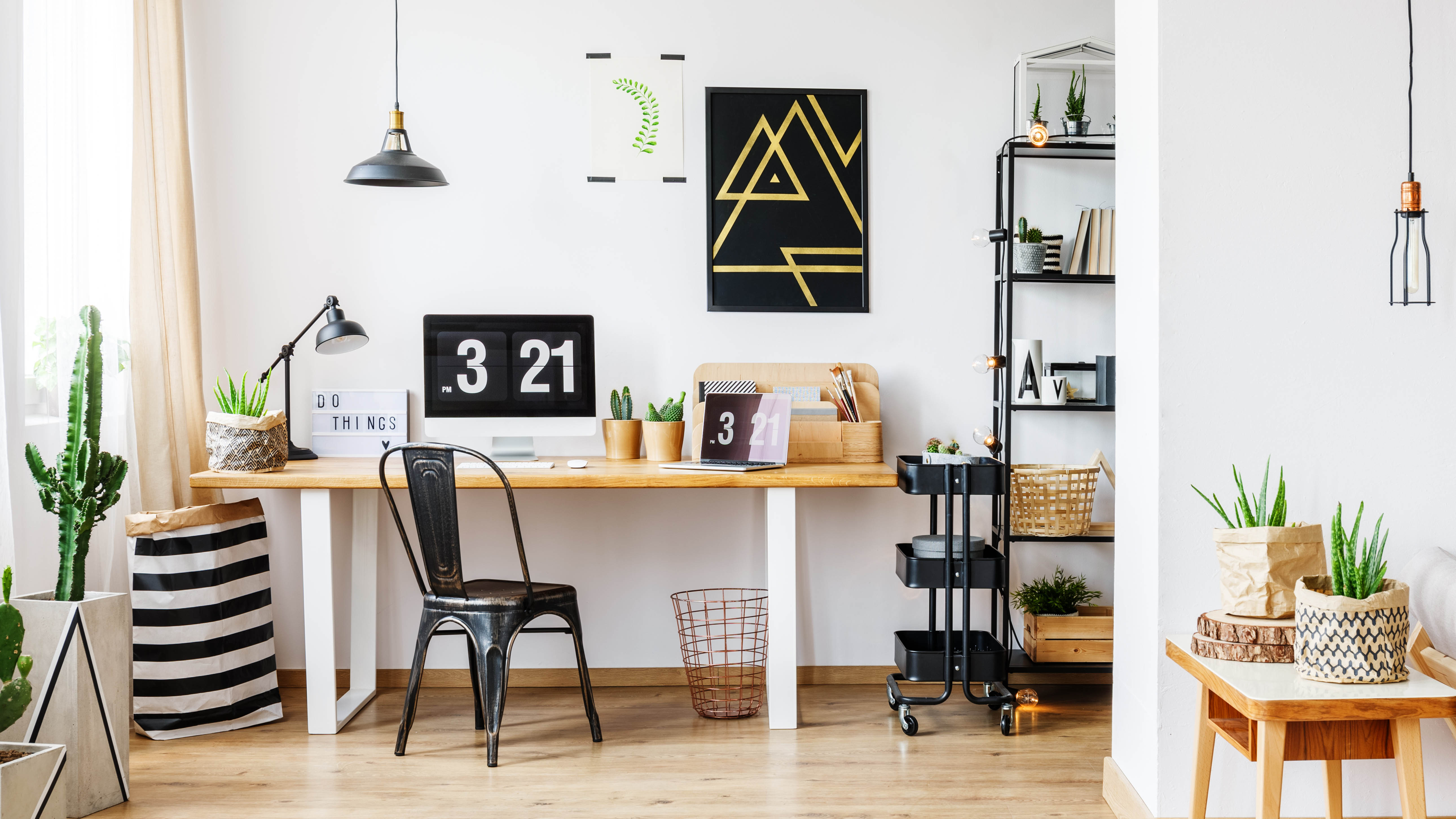 Home Office with a wooden desk and black trolley next to it