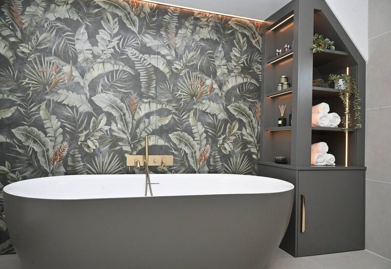 Adam O'Sullivan from AOS Carpentry & Tischlery gives the bathroom and cabinets the finishing touch. 
