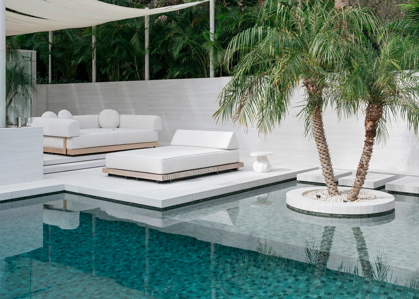 Image can contain pool water couch furniture swimming pool in the interior designer in the interior designer backyard nature and outdoors