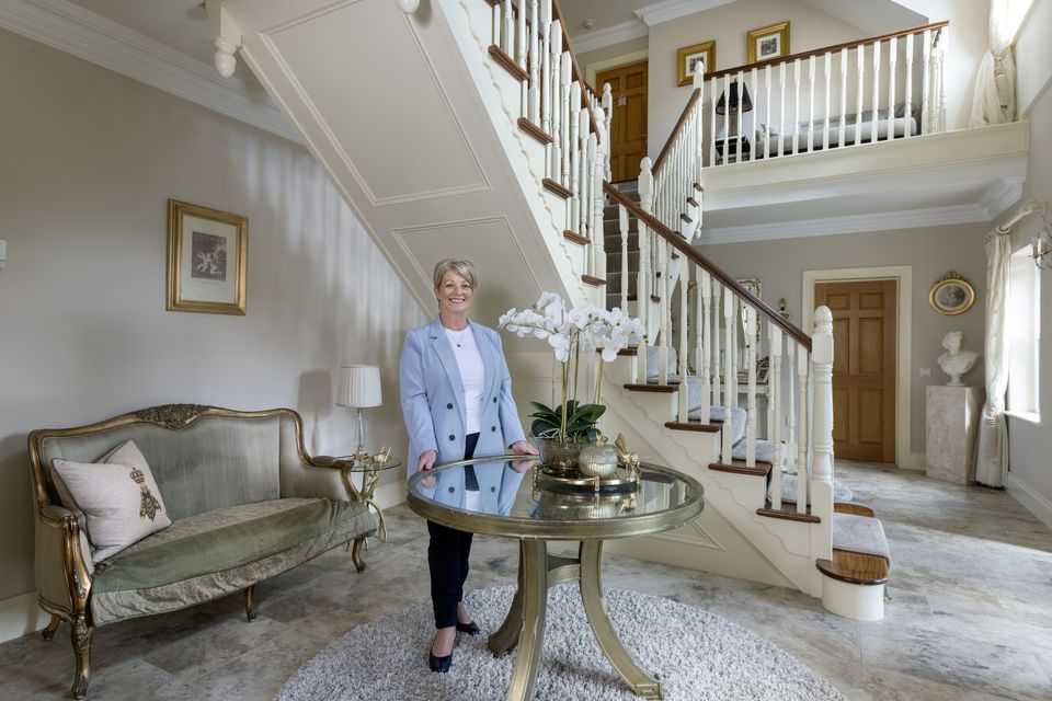 The retailer Dervla Golden, who, with its double-sided staircase, monitored the Boutique and Bakery of Mrs Tea in the five-star lock in Ashford, which was built into a double-sided staircase, which she stood in ballin robe, Co Mayo, with her engineering husband Brian. The circular table came from an auction in Ashford Castle. Photo: Tony Gavin