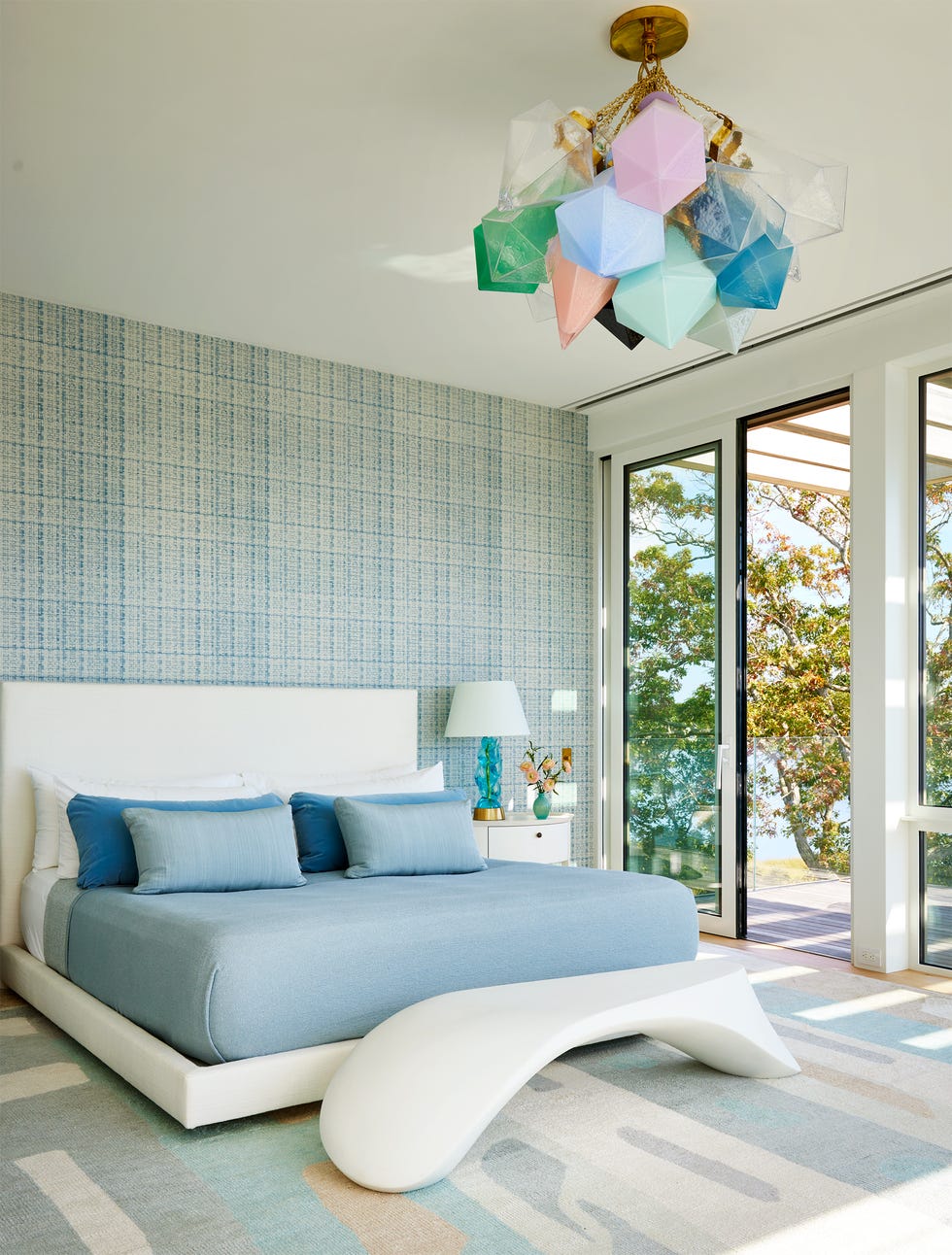 Bedroom with wavy white -shaped plastic bench