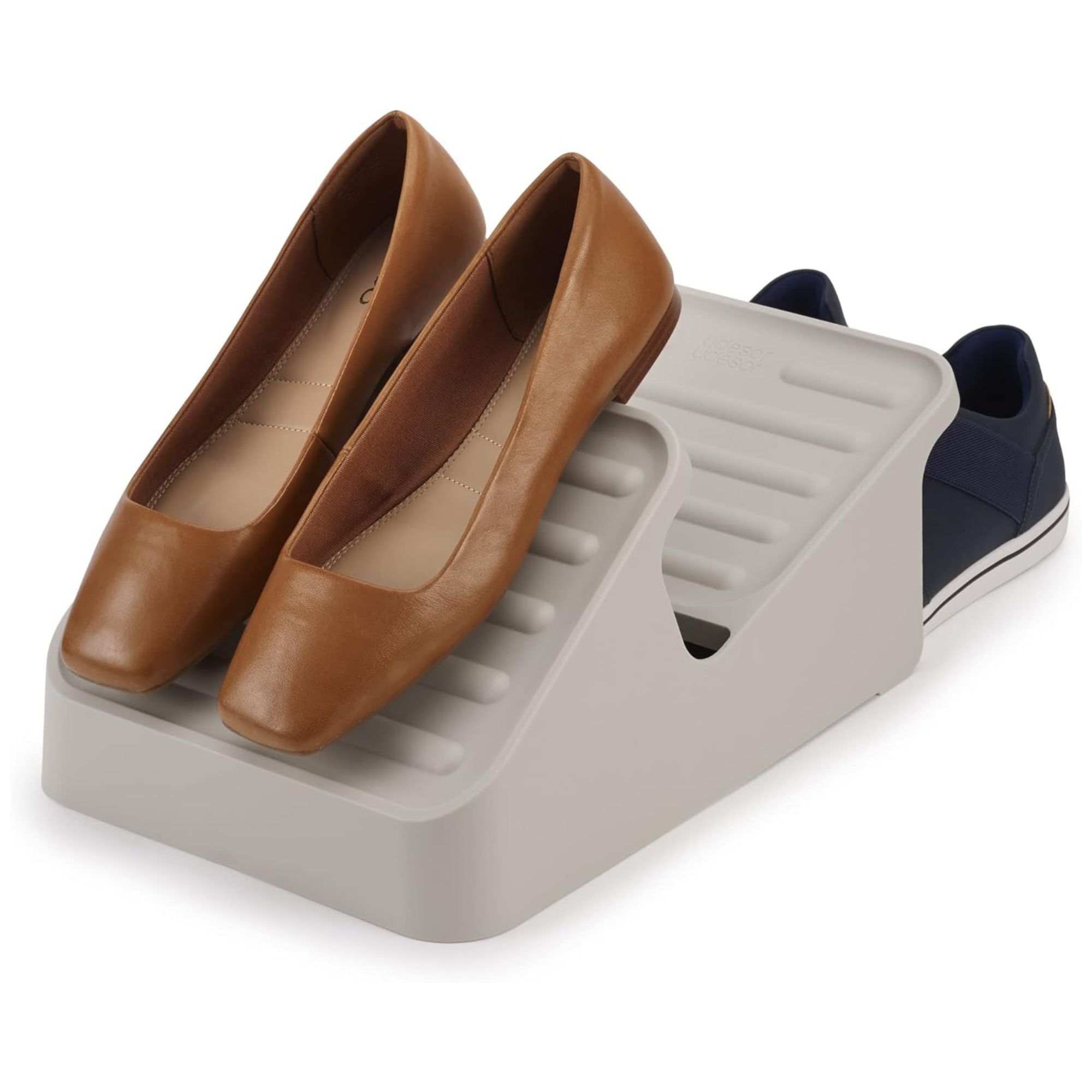A gray shoe organizer with two pairs of shoes.