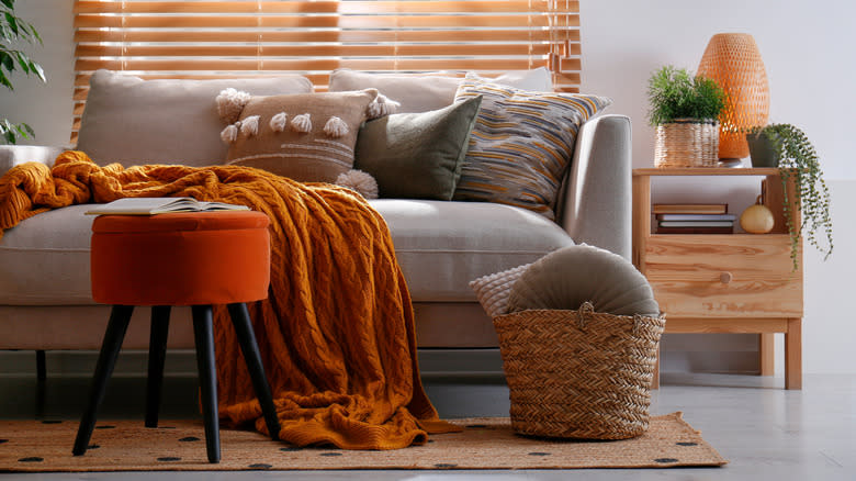 Founding stool with red fabric, which is in contrast to other furniture colors