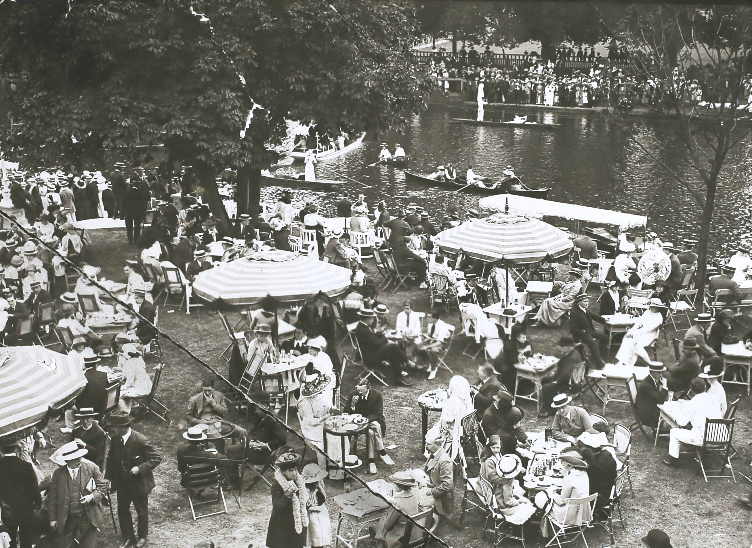 People who enjoy the lawn of a Riverside Resort Hotel Tea.
