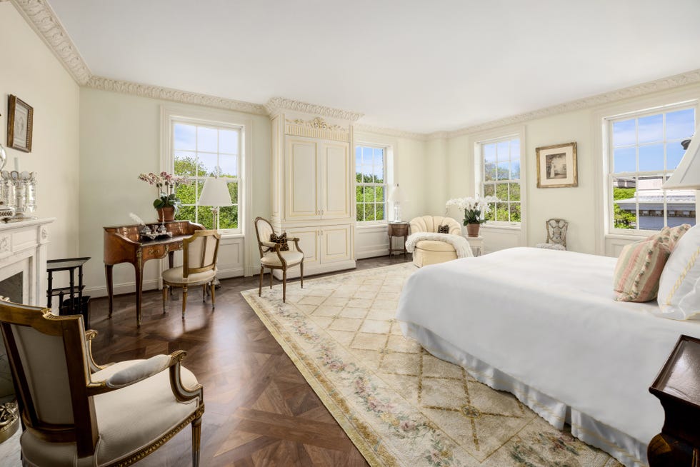 Spacious and elegantly furnished bedroom.