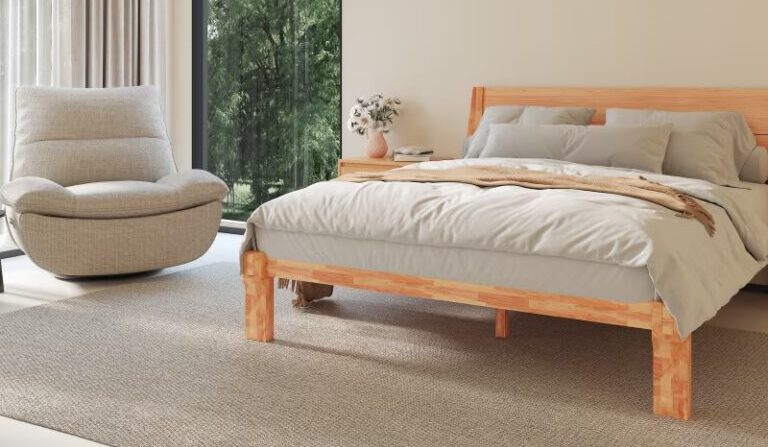 A neutral colored FlexiSpot -Lotus loungers sits in a Japanese carpenter bed in a room filled with natural light