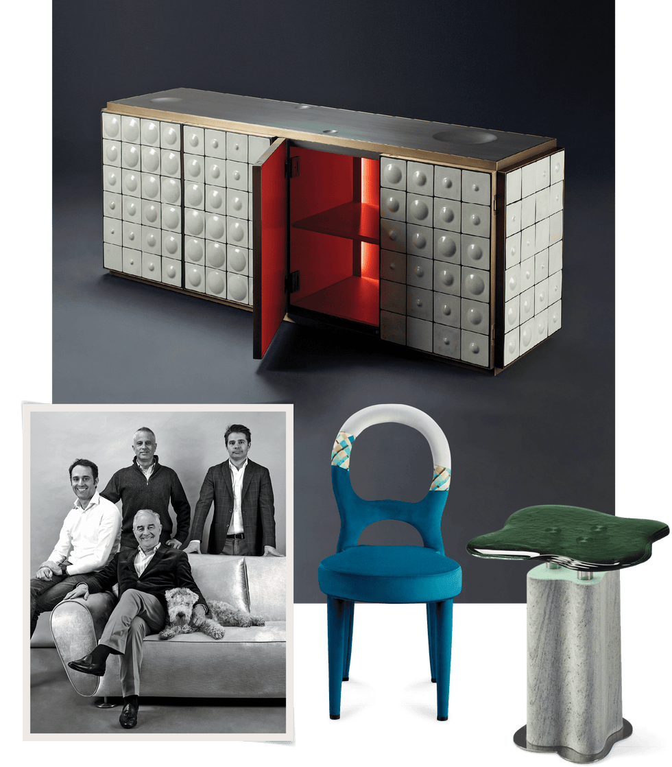 A group of four male designers and a dog in black and white and cool furniture surrounded