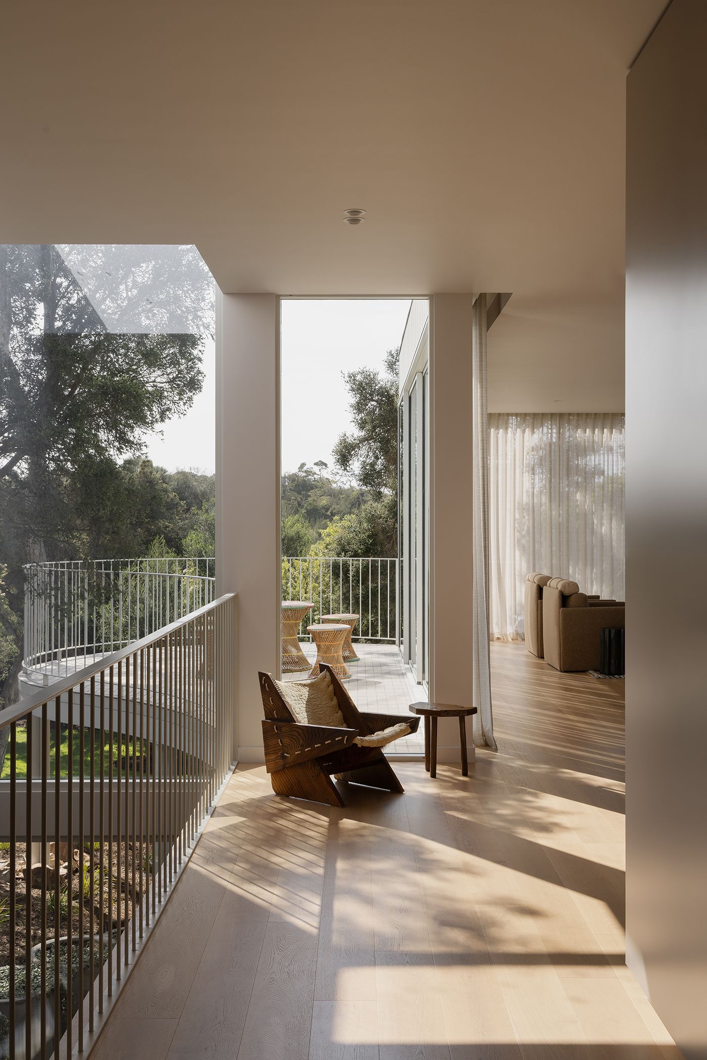 Window front with a view of the trees and balcony