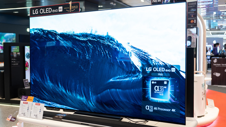 An LG OLED TV that is exhibited in a shop.