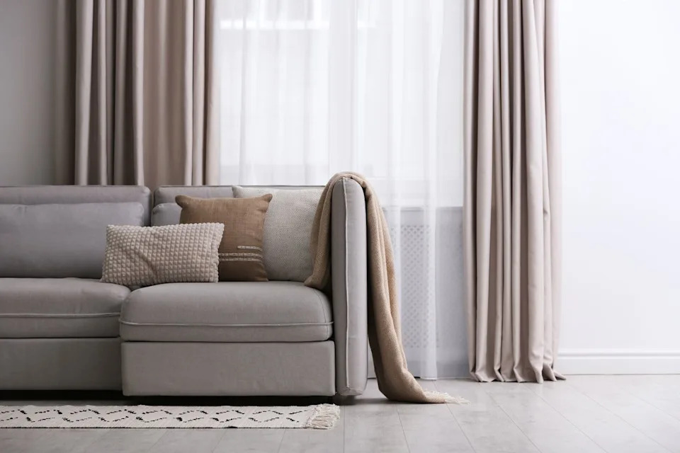 Modern living room interior with beautiful curtains by the window