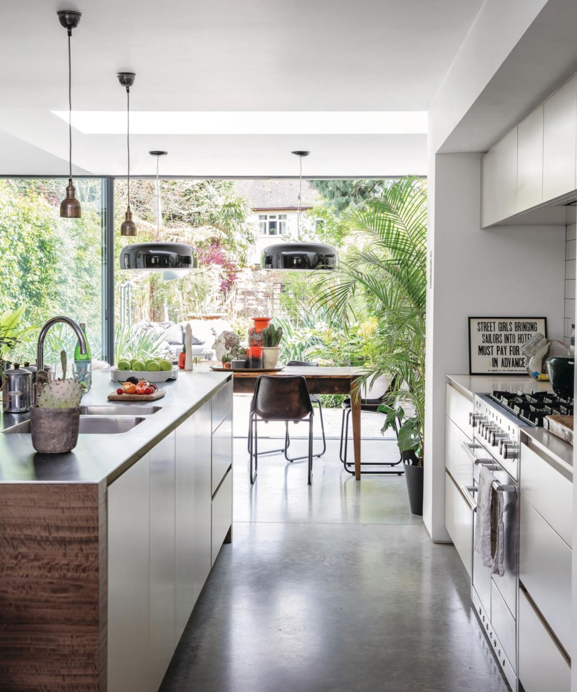 Modern kitchen with stainless steel worktops