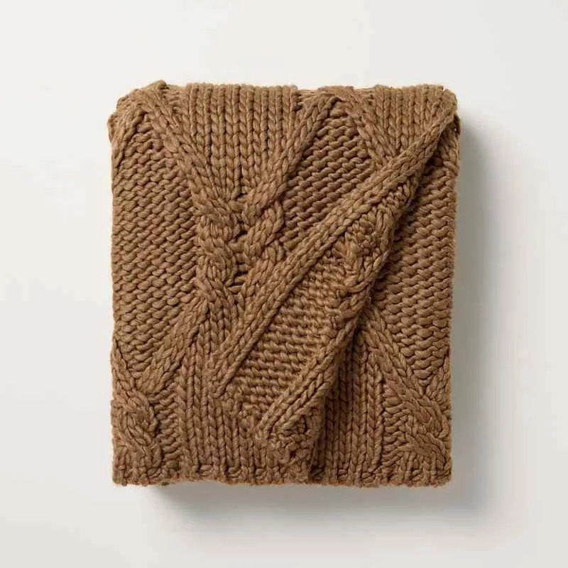 Stove & hand with Magnolia Cable Strit -throwing blanket