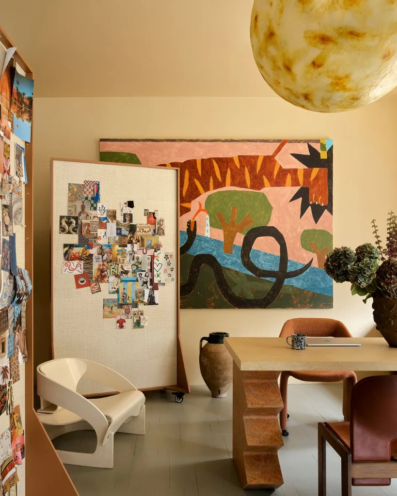 A lively work of art by Cannon Dill entitled Tiger and Snake in the garden fills the wall in Chris' office in the offices of Alemis Sydney. 