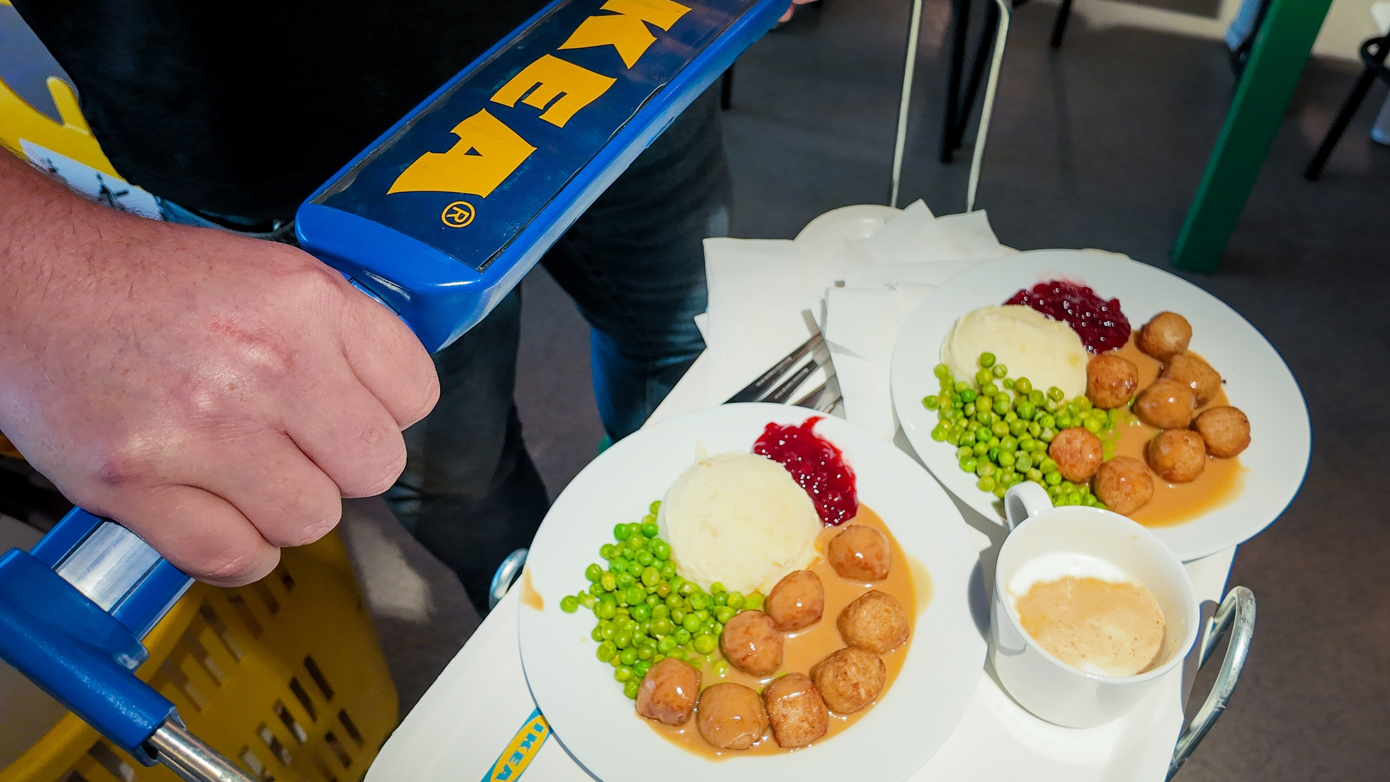Ikea Swedish meatballs on two plates and a coffee