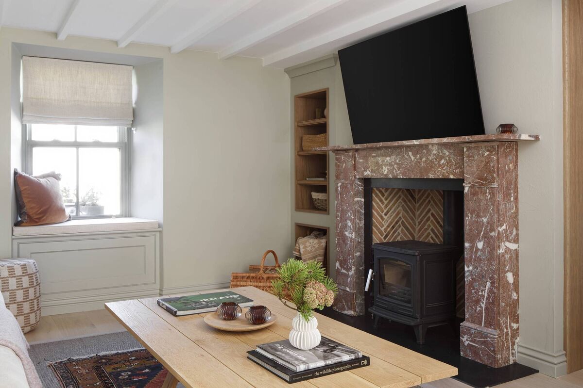 The ancient Rose -Rosa fireplace in the Heil living area is one of the outstanding features of the cottage. The ancient Rose -Rosa fireplace in the Heil living area is one of the outstanding features of the cottage.