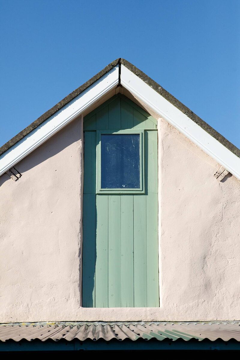 One of the green -painted doors of the cottage. One of the green -painted doors of the cottage.