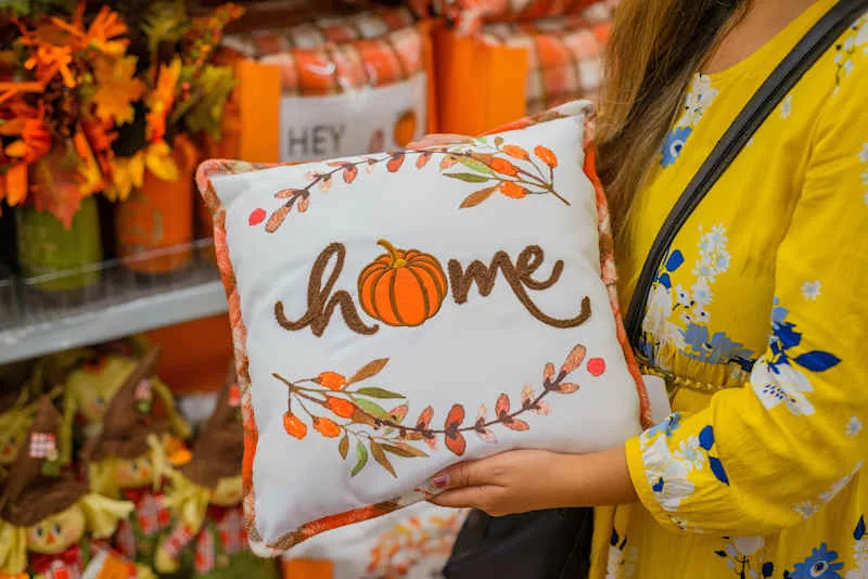 Autumn theme embroidered pillow. Sale of decorative objects from the autumn season.