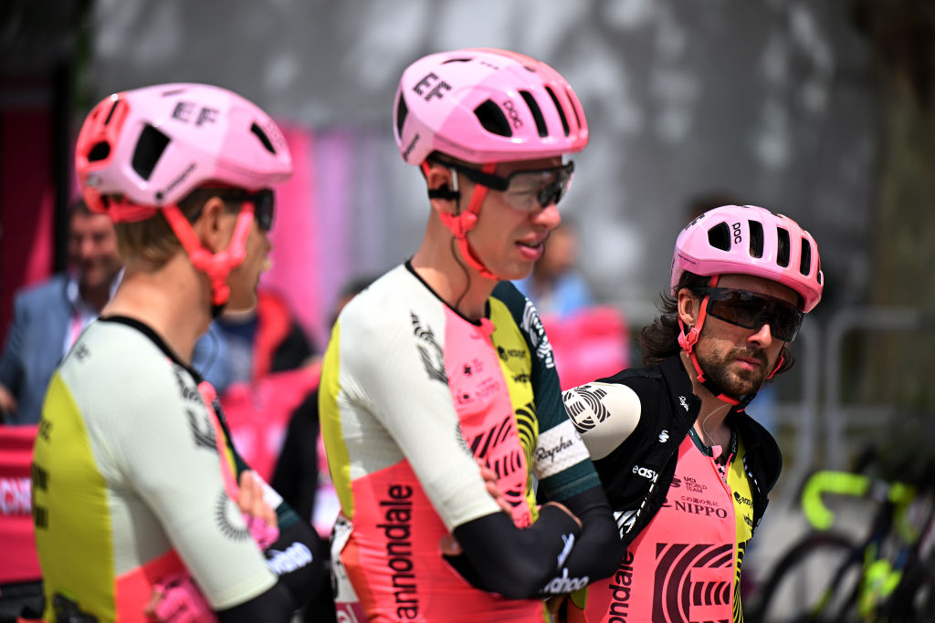 Men in Lycra stand and talk