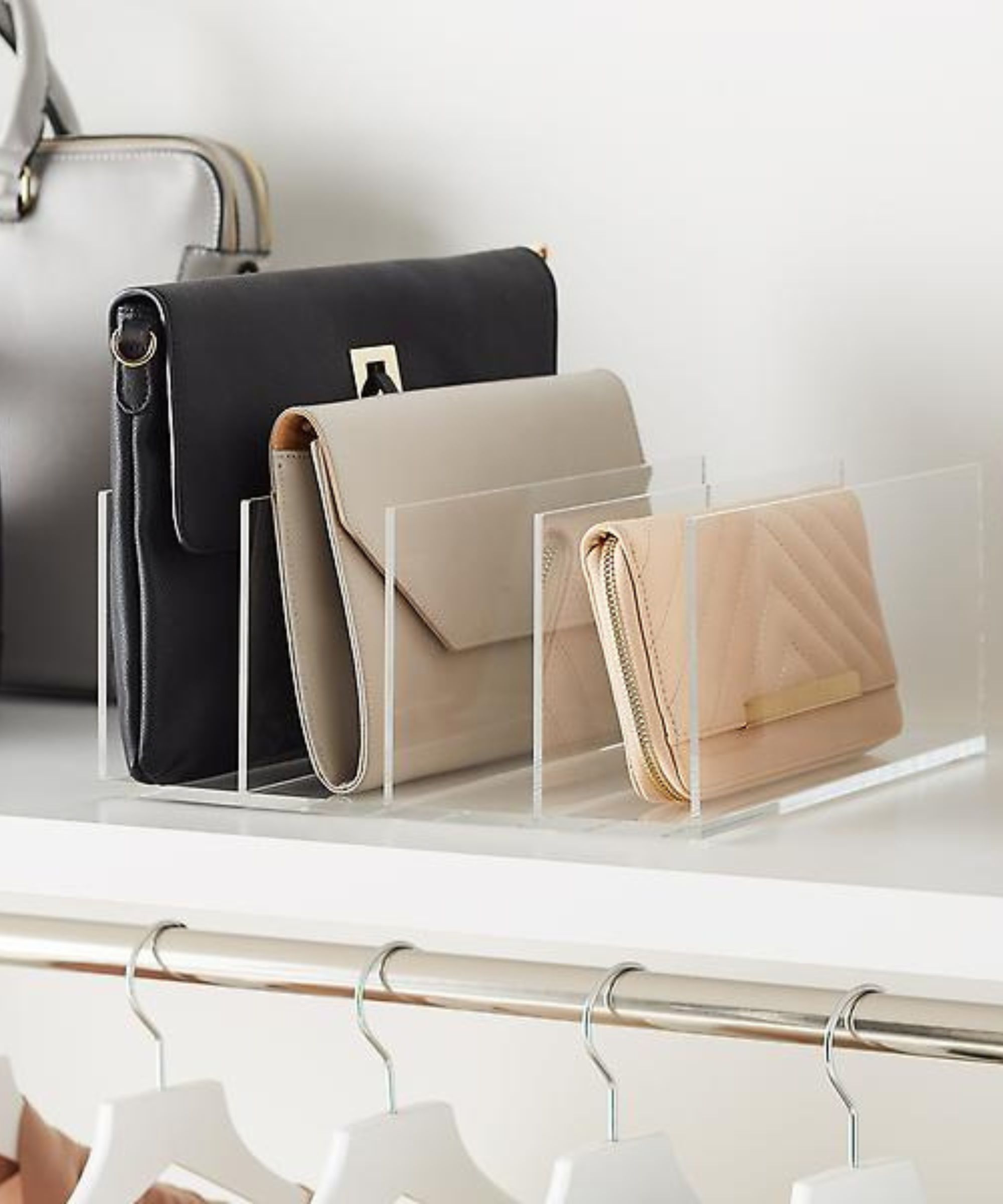 A shelf divider for the handbag organizer