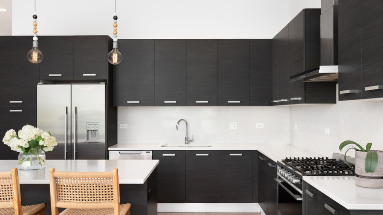 Kitchen with dark wooden cabinets
