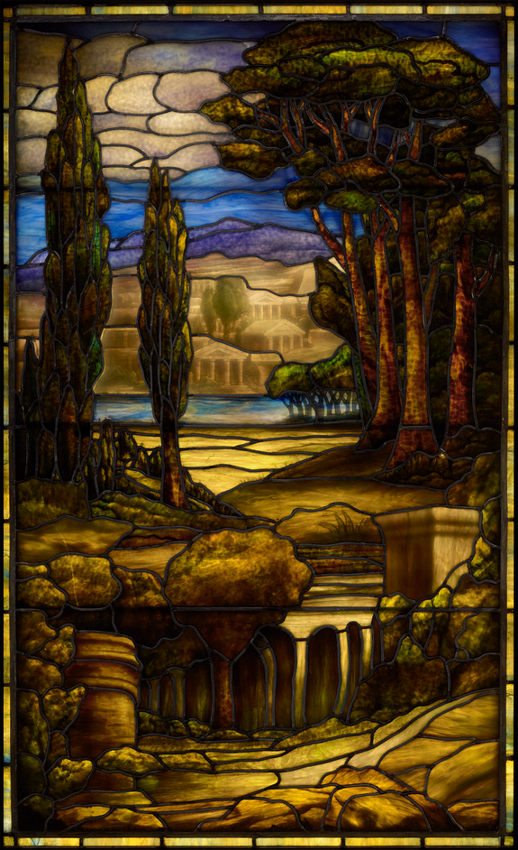 Stained glass art depicting a tranquil landscape with tall trees, distant hills and a cloudy sky.