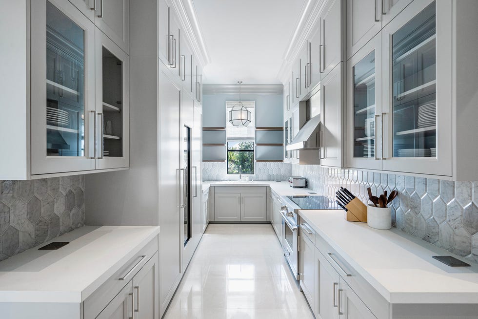 Modern kitchen with elegant cabinets and natural light.
