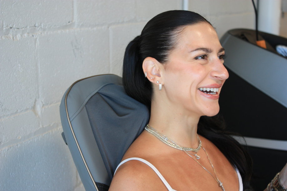 Our expert receives a neck massage from a Homedics massage chair