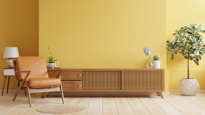 Yellow painted walls in a mid-century modern room