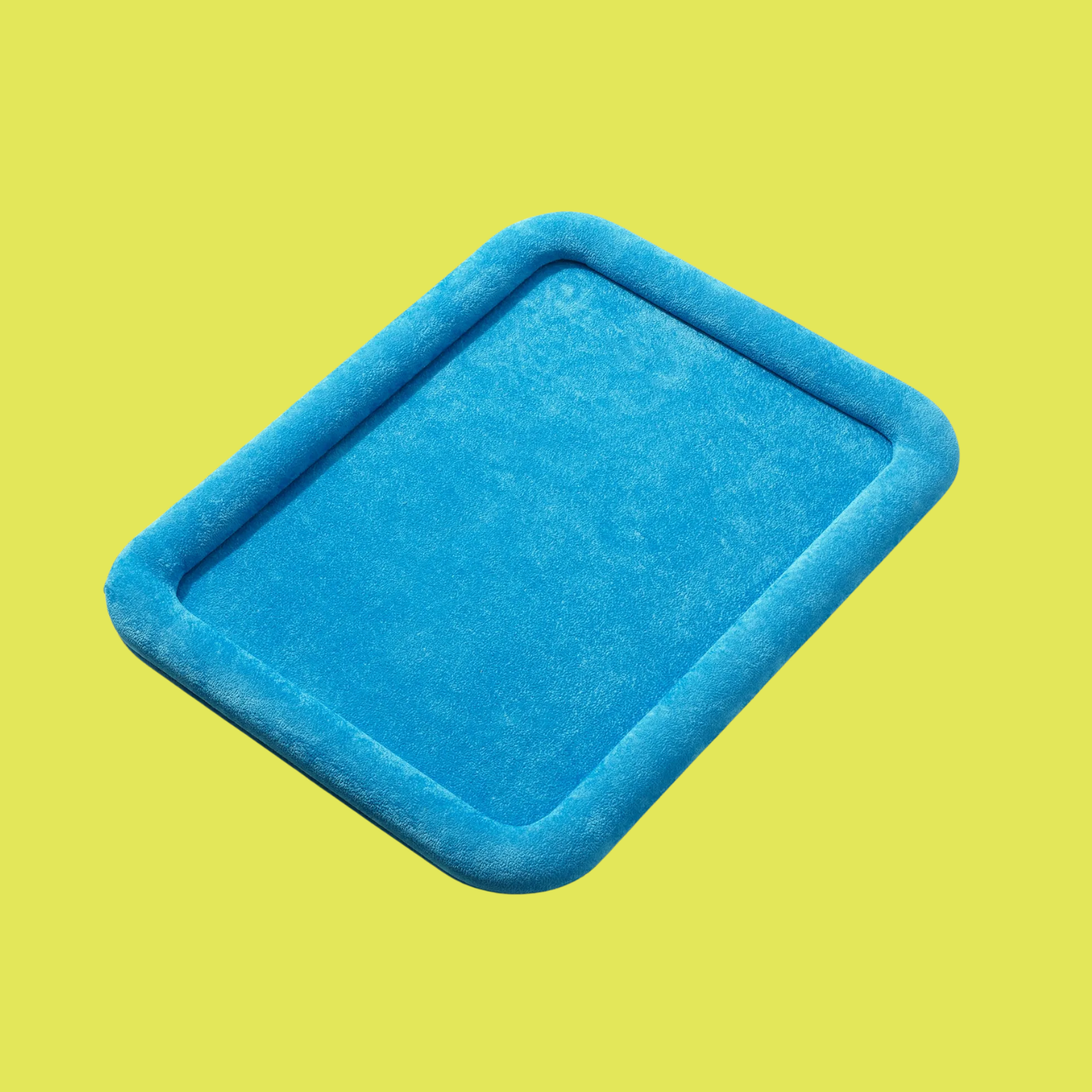 A bright blue jewelry tray