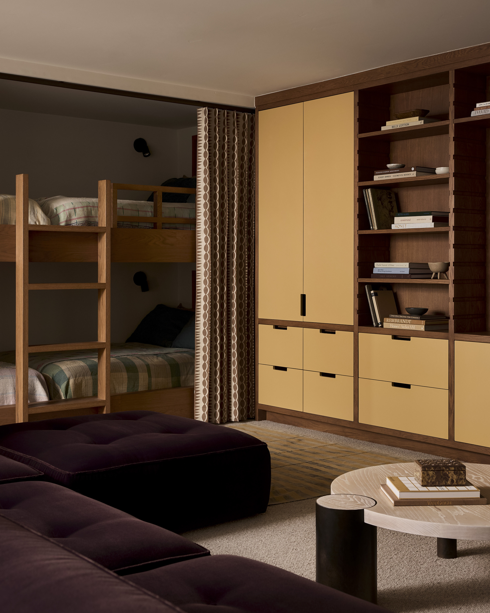 Image of a bedroom with a purple closet and a butter yellow built-in closet. The bunk beds are wooden with olive green linens